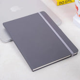 Grey Fluct PRO A5 Diary for organized planning, featuring a sleek elastic closure and minimalist design, ideal for office or corporate use.